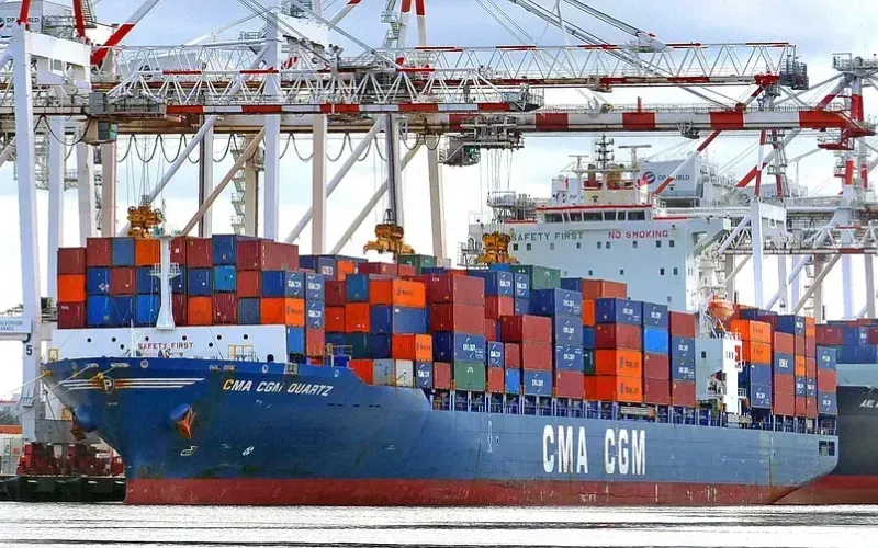 Container ship alongside quay cranes